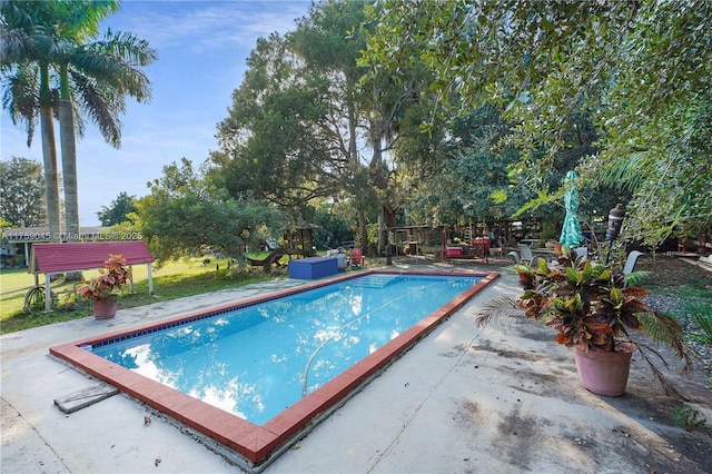 outdoor pool featuring a patio area