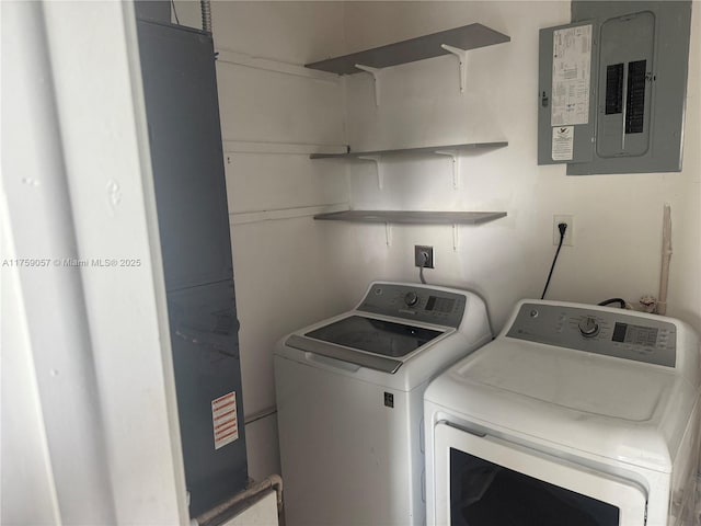 laundry area featuring laundry area, electric panel, and washer and dryer