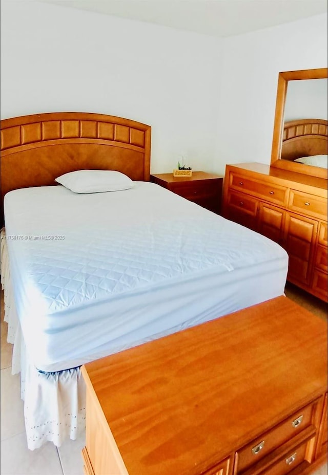 bedroom featuring light tile patterned floors