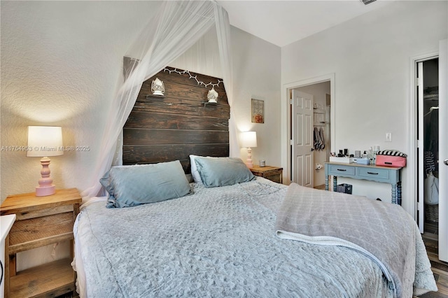 bedroom with wood finished floors