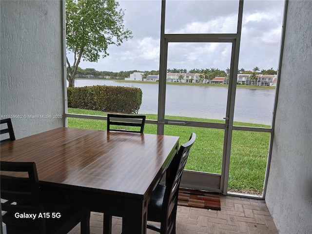 sunroom with a water view