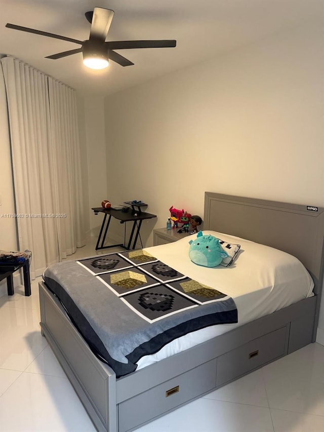 bedroom featuring a ceiling fan and light tile patterned floors