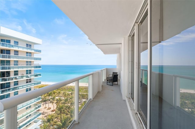 balcony featuring a water view