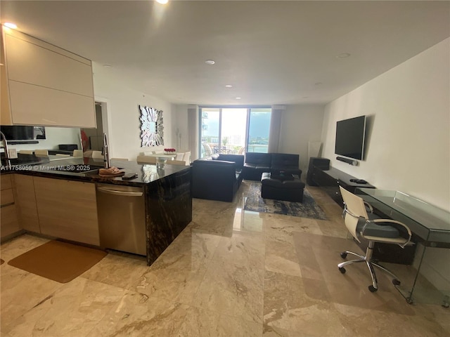 kitchen featuring dishwasher, modern cabinets, open floor plan, a peninsula, and a sink