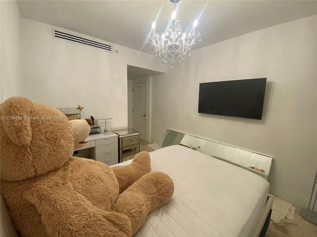 bedroom with visible vents and an inviting chandelier