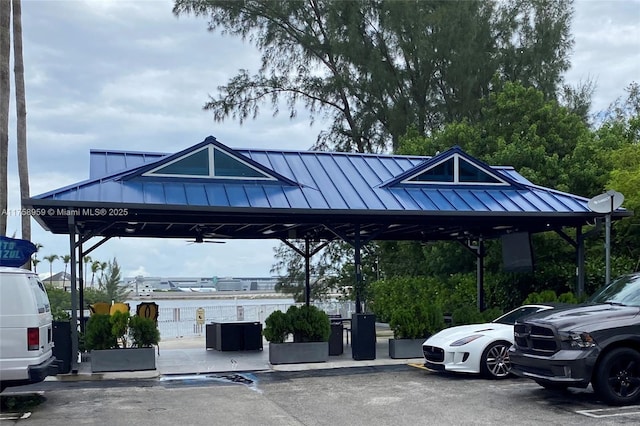 uncovered parking lot with a water view