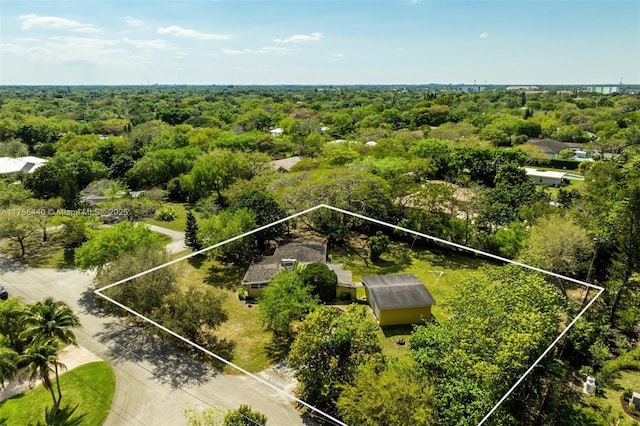 birds eye view of property with a wooded view