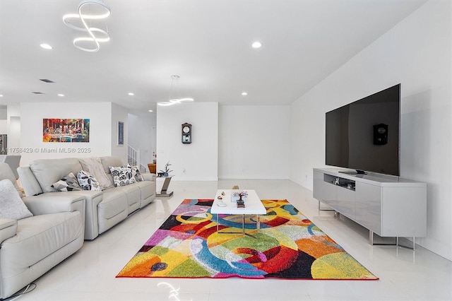 living area with an inviting chandelier and recessed lighting