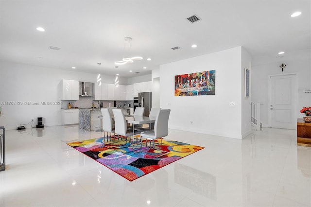 dining space with recessed lighting, visible vents, baseboards, and light tile patterned flooring