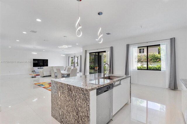 kitchen with white cabinetry, a center island with sink, a sink, visible vents, and dishwasher