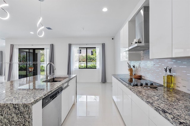 kitchen featuring dishwasher, wall chimney exhaust hood, modern cabinets, black electric cooktop, and a sink