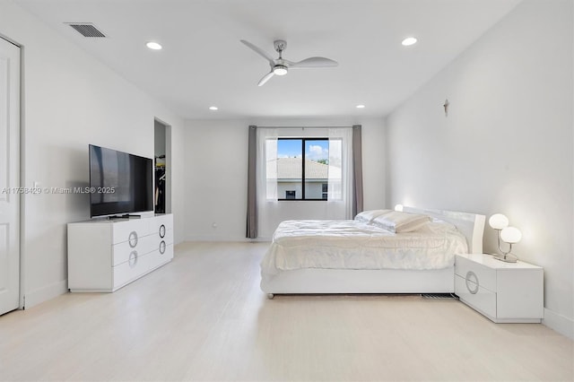 bedroom with light wood-type flooring, recessed lighting, baseboards, visible vents, and a ceiling fan