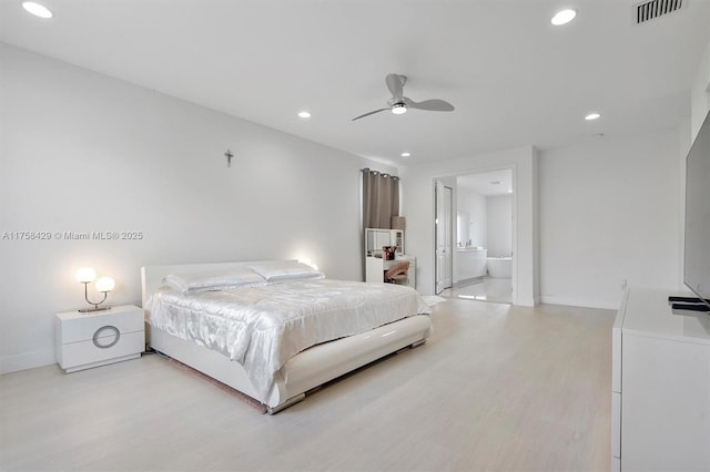 bedroom featuring light wood-style floors, recessed lighting, visible vents, and baseboards