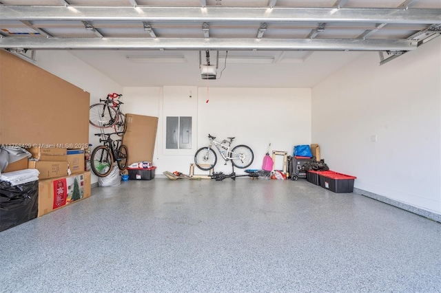 garage with electric panel and a garage door opener