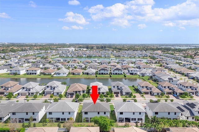 aerial view featuring a water view and a residential view