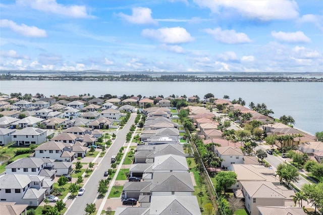 aerial view with a water view and a residential view