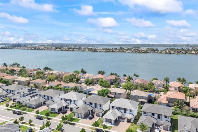 bird's eye view with a residential view and a water view