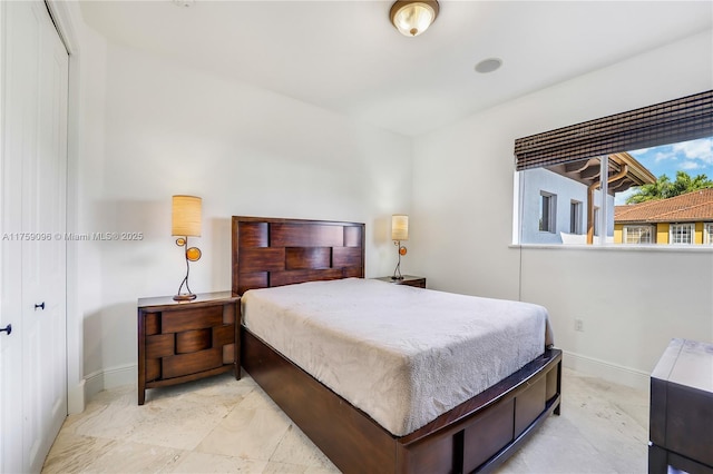 bedroom featuring baseboards