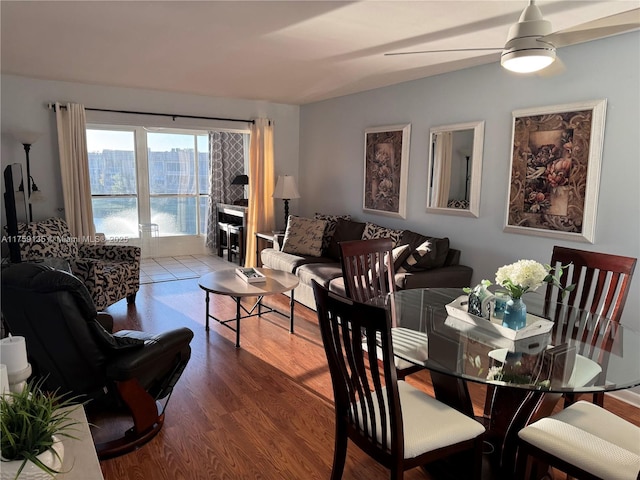 dining room featuring ceiling fan and wood finished floors