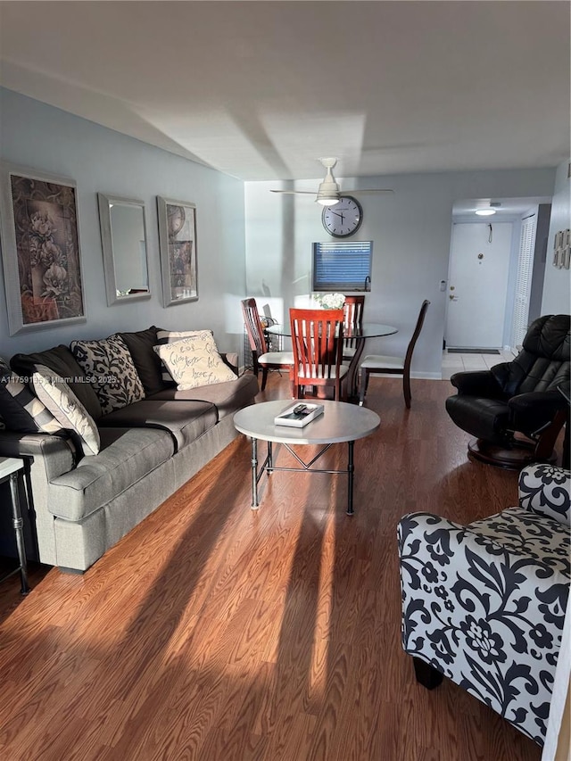 living area featuring ceiling fan and wood finished floors