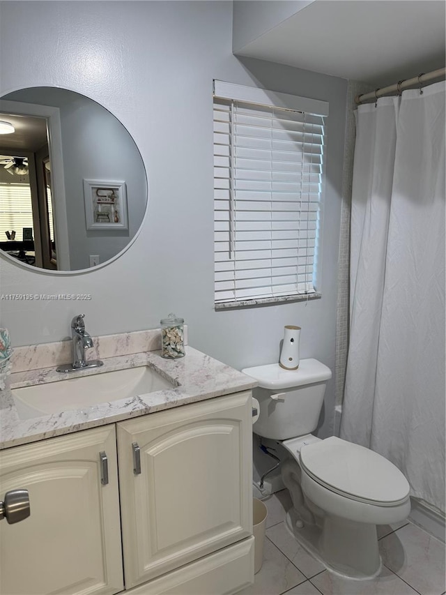 full bathroom with a ceiling fan, toilet, and vanity