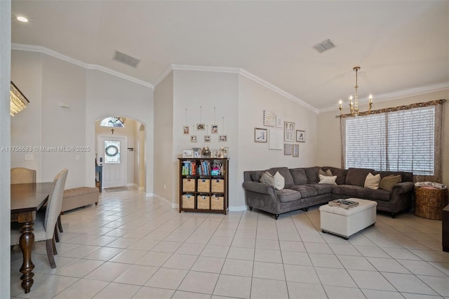 living area with arched walkways, visible vents, crown molding, and light tile patterned flooring