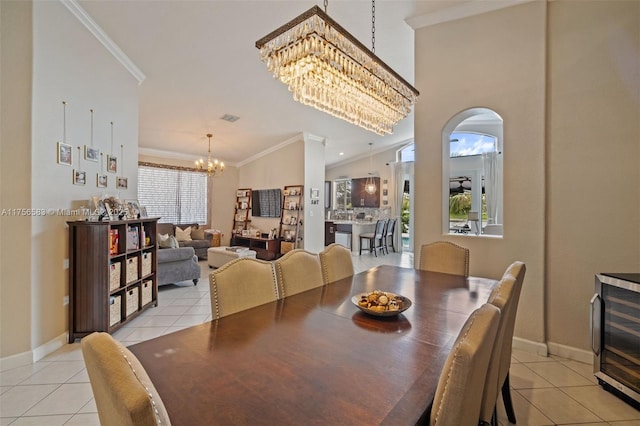 dining room with wine cooler, crown molding, light tile patterned flooring, a chandelier, and baseboards