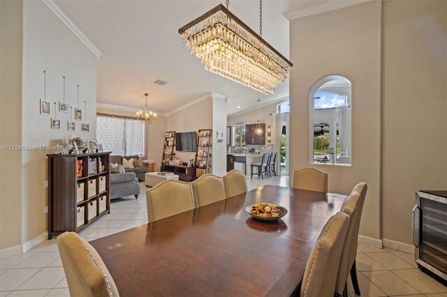 kitchen featuring stainless steel appliances, backsplash, crown molding, and a peninsula