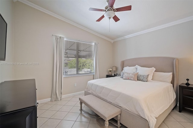 bedroom with crown molding, vaulted ceiling, baseboards, and light tile patterned floors