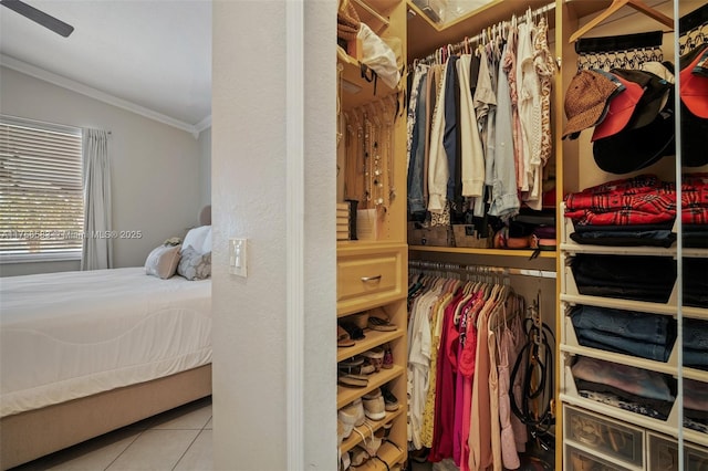 walk in closet featuring vaulted ceiling and tile patterned floors