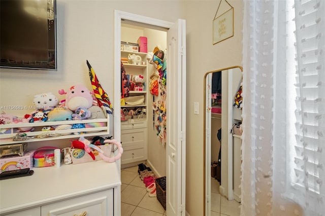 playroom with light tile patterned flooring