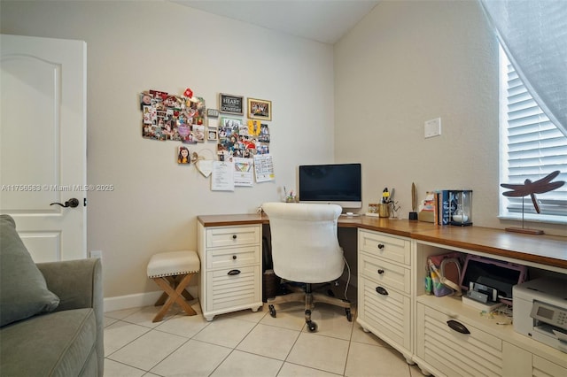 office space featuring light tile patterned floors and baseboards