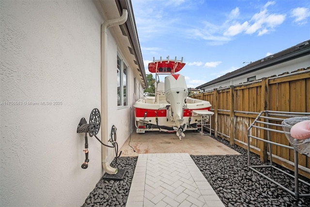 view of patio / terrace featuring fence