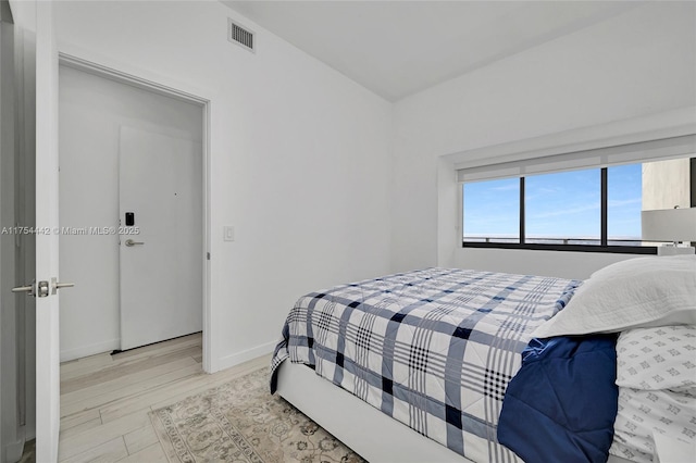 480 NE 31st St Unit 4805, Miami, FL 33137 - bedroom with visible vents, baseboards, and wood finished floors
