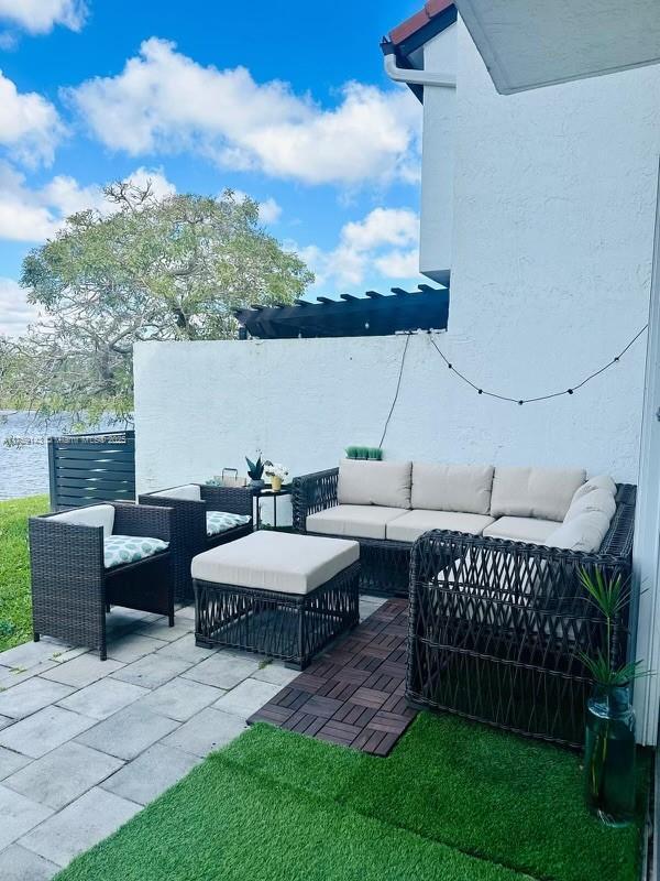 view of patio / terrace with fence and outdoor lounge area