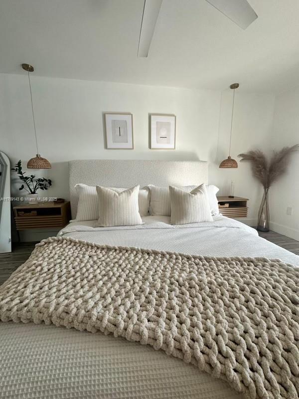 bedroom featuring wood finished floors