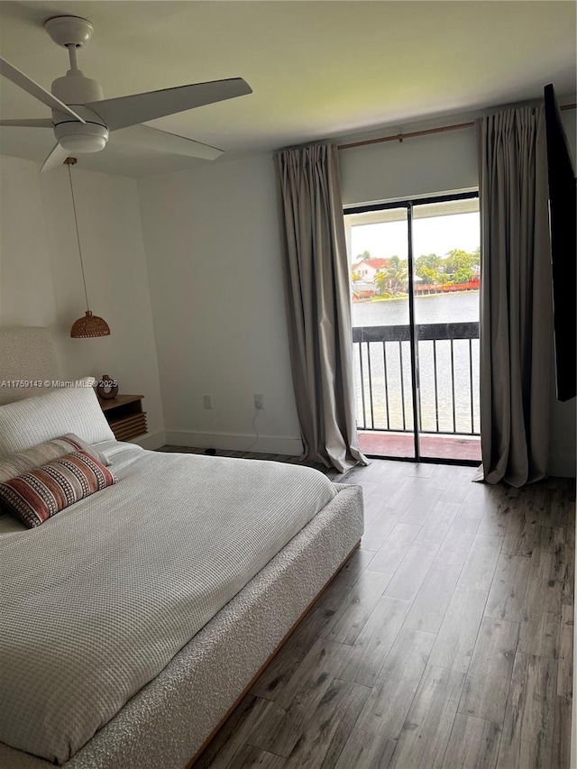 bedroom with access to outside, baseboards, ceiling fan, and wood finished floors