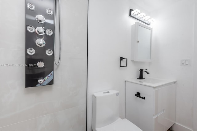 bathroom featuring toilet and a sink