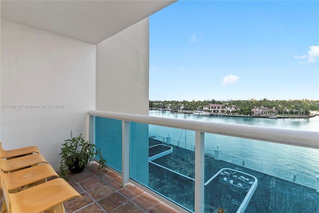 balcony featuring a water view