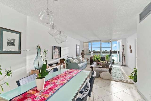 6770 Indian Creek Dr Unit 5K, Miami Beach, FL 33141 - dining room featuring a textured ceiling, floor to ceiling windows, visible vents, and tile patterned floors
