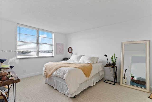 6770 Indian Creek Dr Unit 5K, Miami Beach, FL 33141 - bedroom with light colored carpet, baseboards, and a textured ceiling