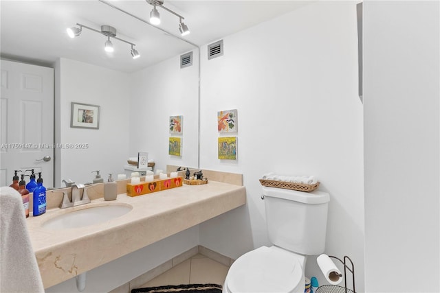 6770 Indian Creek Dr Unit 5K, Miami Beach, FL 33141 - bathroom with a sink, visible vents, toilet, and tile patterned floors