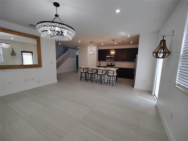 dining area with recessed lighting, stairway, visible vents, and a chandelier