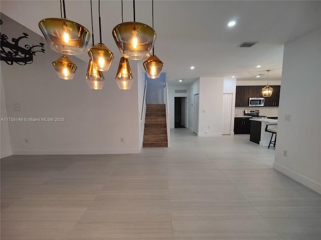 interior space with stairs, recessed lighting, visible vents, and baseboards