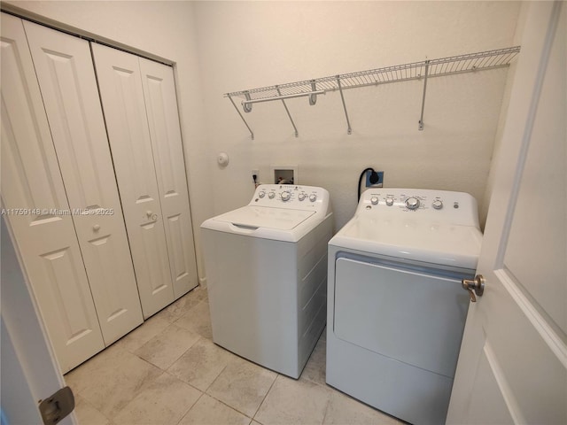 laundry room featuring laundry area and washer and clothes dryer