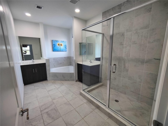 bathroom featuring visible vents, a garden tub, a shower stall, tile patterned flooring, and vanity