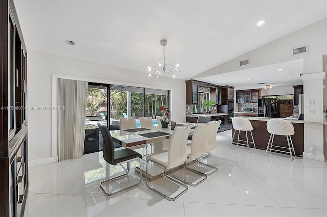 dining area with a chandelier, lofted ceiling, visible vents, and recessed lighting