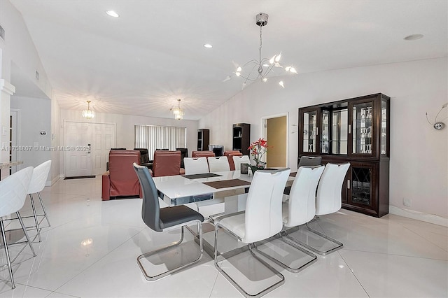 dining room with a chandelier, lofted ceiling, light tile patterned flooring, recessed lighting, and baseboards