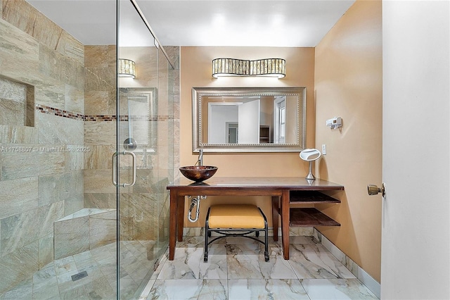 full bathroom featuring a stall shower, marble finish floor, and baseboards