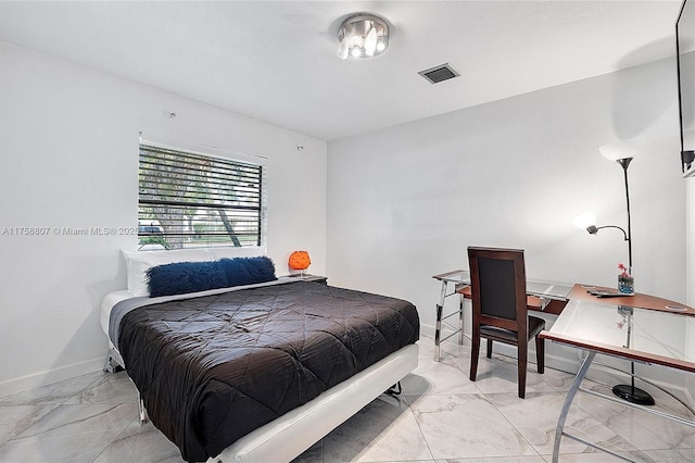 bedroom with marble finish floor, visible vents, and baseboards